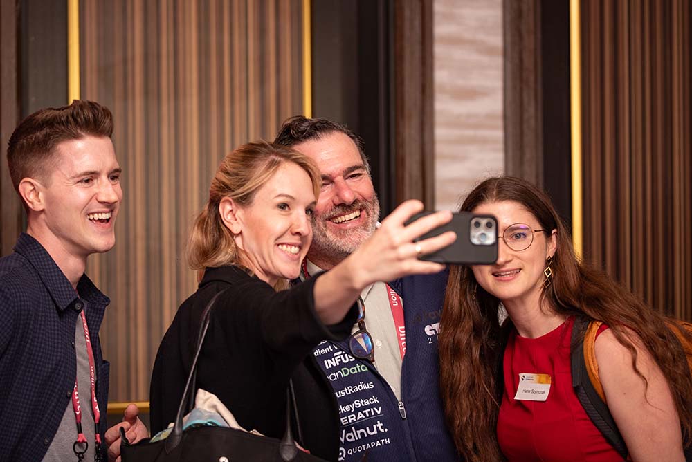 Sam Jacobs taking a selfie with GTM attendees 